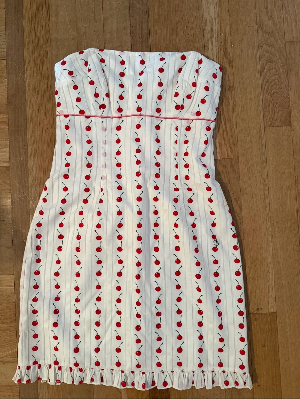 Shoshanna Cherry Sleeveless mini dress in white with a ruffle